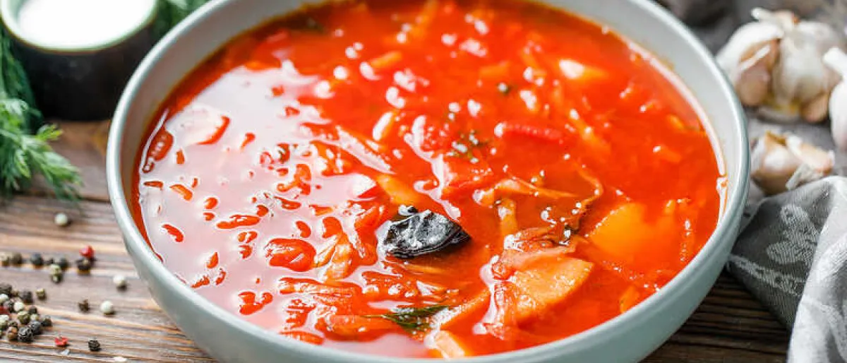 Traditional Ukrainian soup with beets, tomatoes, and pork ribs